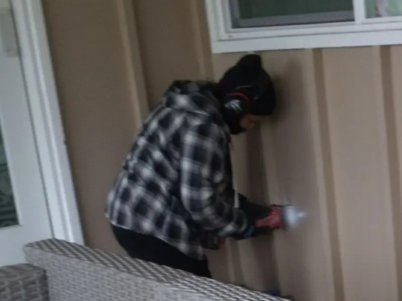 Professional electrician installing an exterior outlet in Barnhart