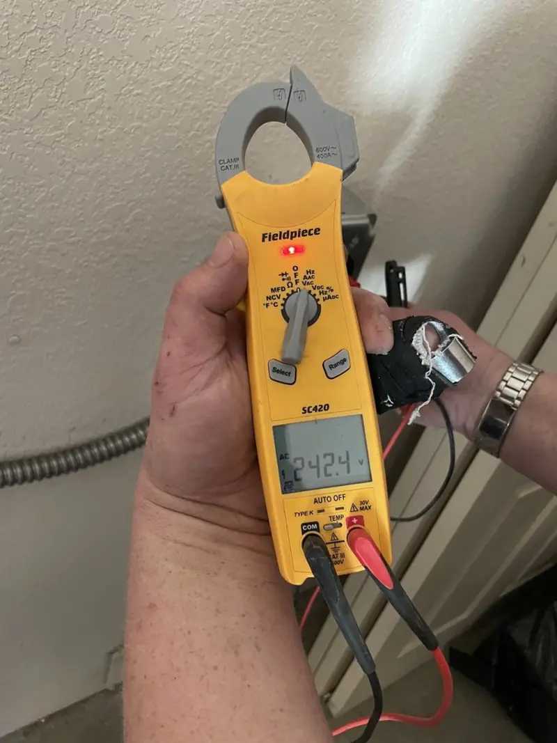 Voltage testing with clamp meter during Outlet Installation in Barnhart